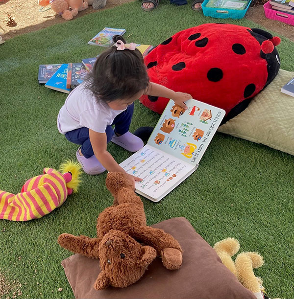 baby reading during book festival