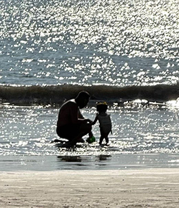 father and son on the beach